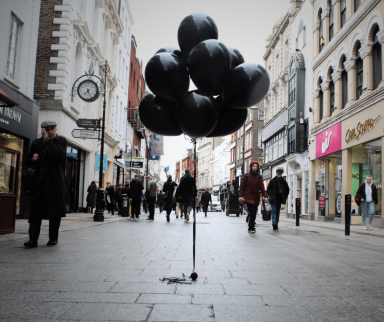 Black balloons float for Black Balloon Day on Grafton Street